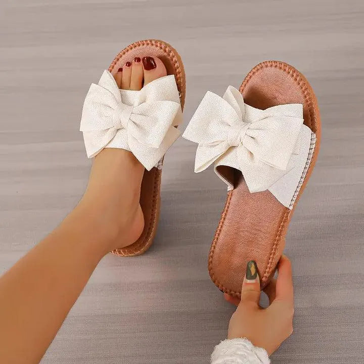 Mel - Comfortabele chique platte slippers met strikje - Visconte